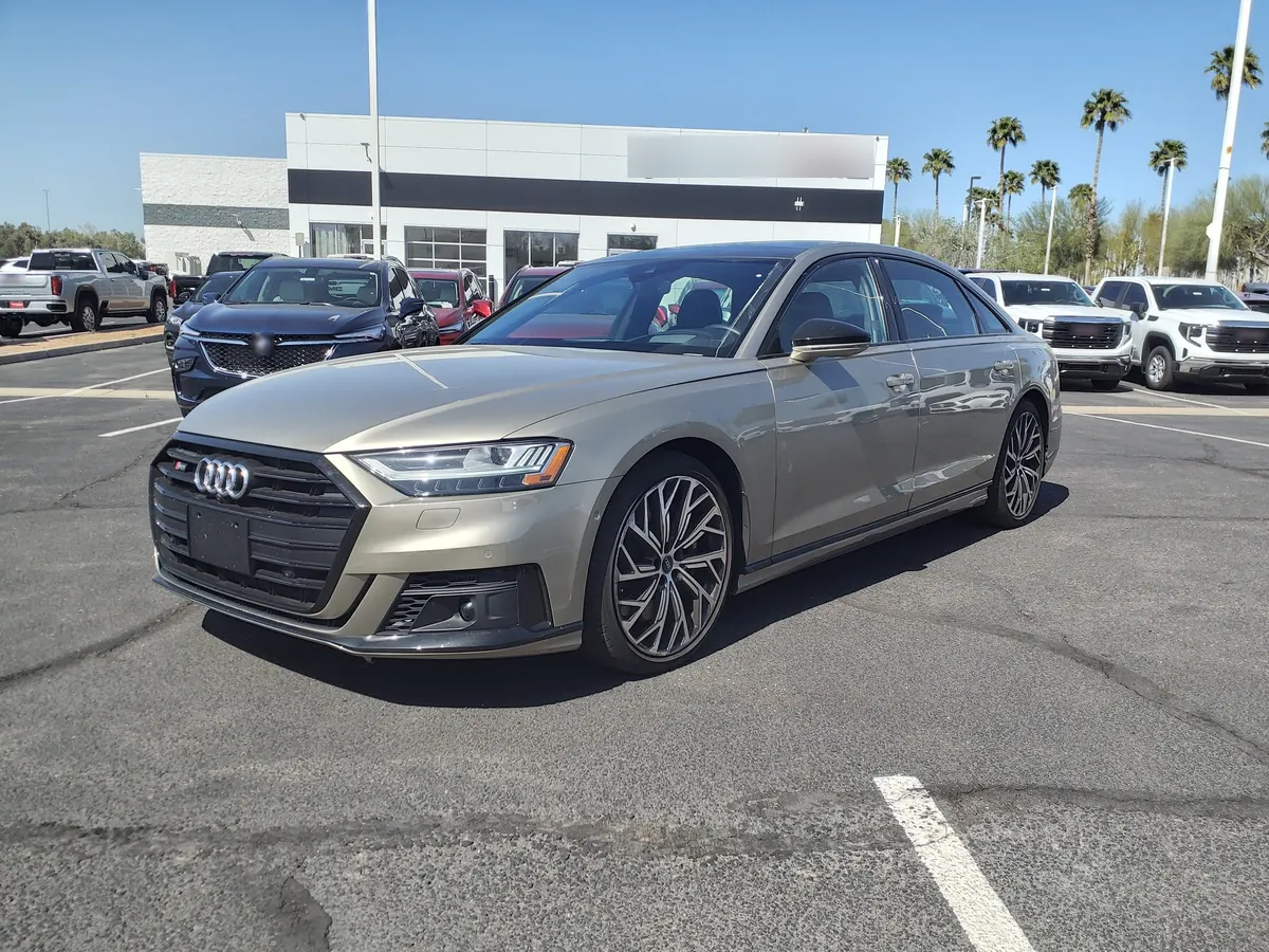 Front three-quarter view of a beige Audi S8 (D5) sedan in a parking lot