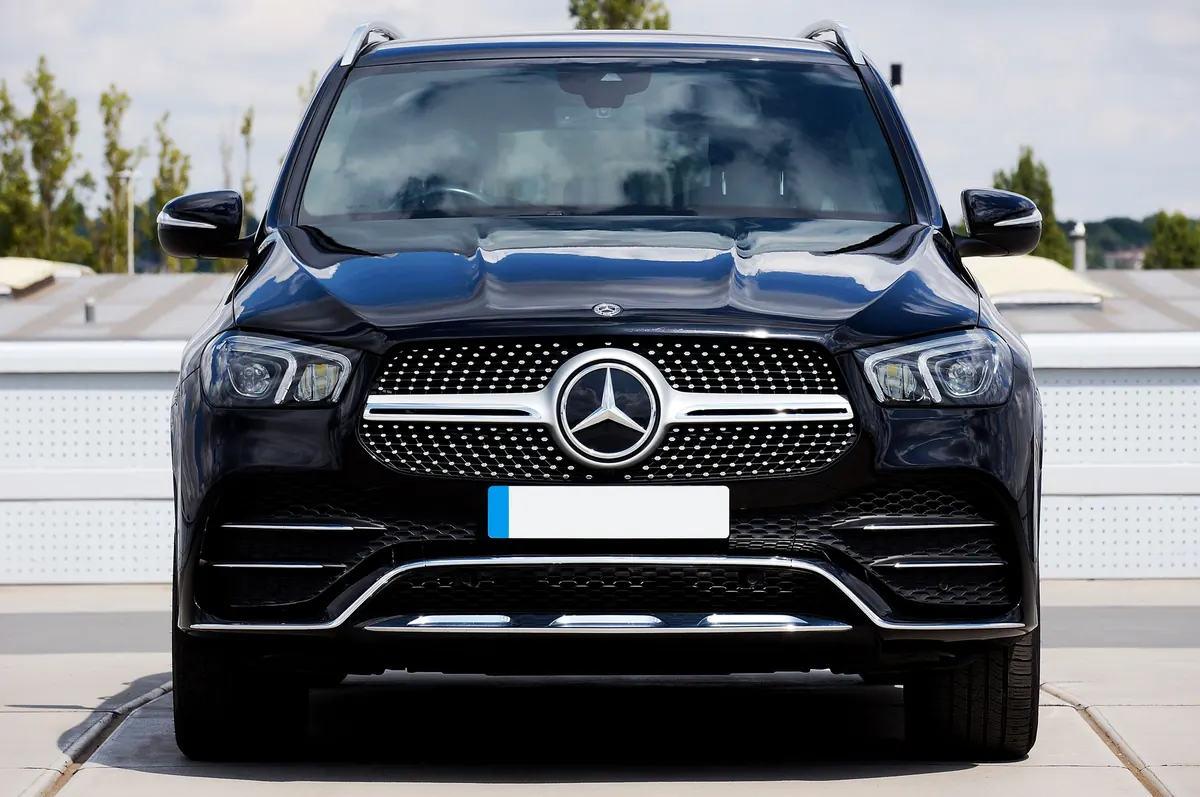 Front view of a black Mercedes-Benz GLE450 (V167) on a rooftop parking deck