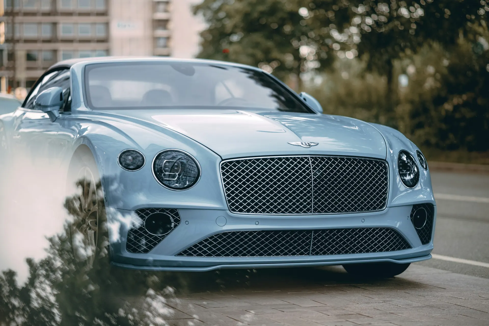 Light blue Bentley Continental GT seen from the front